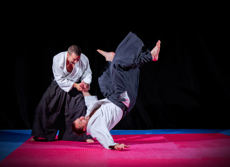 Two martial arts fighters on blackの写真素材