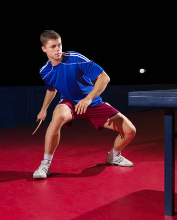 Young table tennis player isolatedの写真素材