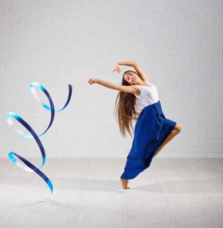 Young girl is engaged in art gymnasticsの写真素材
