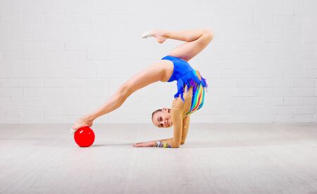 Young girl is engaged in art gymnasticsの写真素材