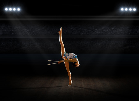 Girl engaged art gymnastics at sports hallの写真素材