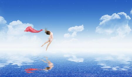 Young dancing girl on water surfaceの写真素材