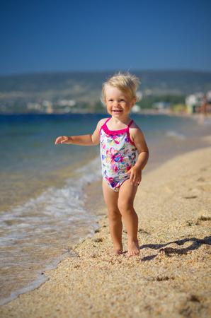 Little girl on sea coastの写真素材