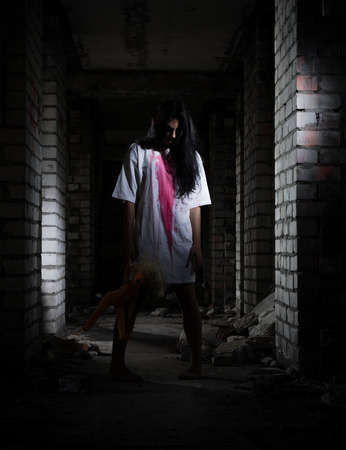 Zombie girl at old houseの写真素材