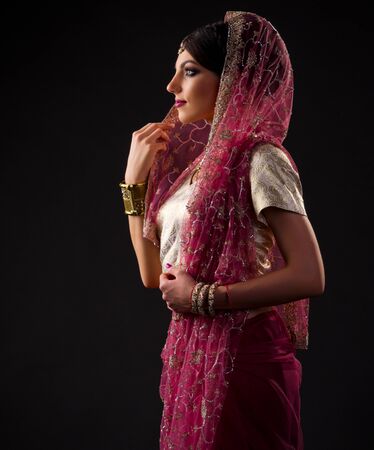 Indian young woman on blackの写真素材