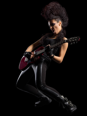 Hard rock singer young woman isolatedの写真素材