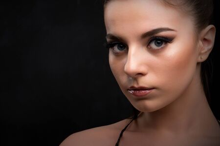 Low key portrait of young girlの写真素材