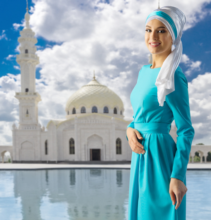 Young muslim girl on mosque backgroundの写真素材