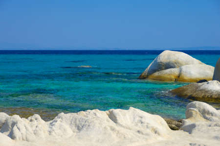 Blue sea shore under clear skyの写真素材