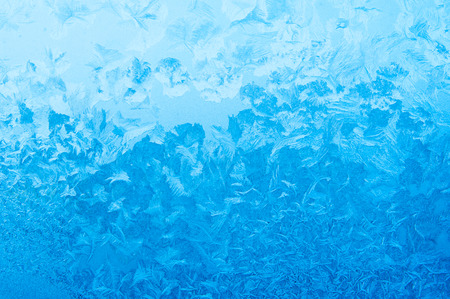 Light blue frozen window glassの写真素材