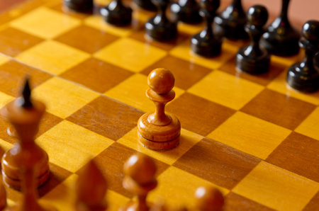 Chessboard with figures on dark background