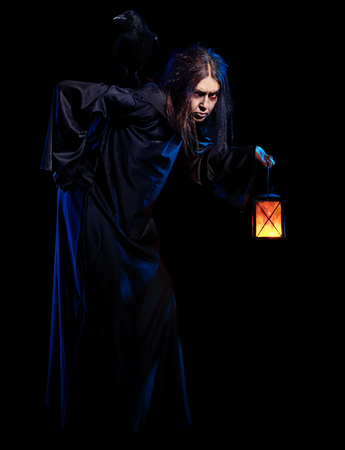 Scary witch isolated on blackの写真素材