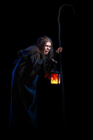 Scary witch isolated on black without raven versionの写真素材