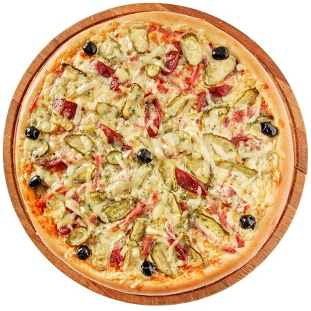 Rustic pizza with ham, sausages, pickles, olives and mozzarellaの写真素材