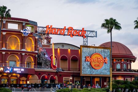 FLORIDA, USA - March 8, 2019 - Hard Rock Cafe at sunset with neon lights at Universal Studios City Walk, Floridaのeditorial素材