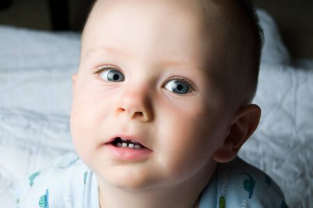 Baby with blue eyesの写真素材