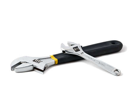Two mechanics wrenches, both adjustable isolated on white background