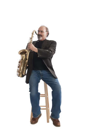 Adult male playing a tenor sax isolated on a white background.の写真素材