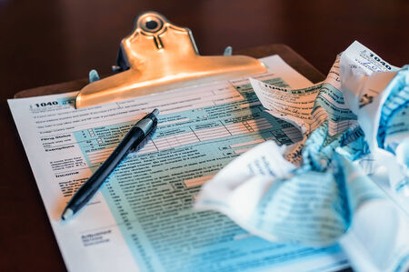 Concept of filing income tax in the USA on a form 1040. Servral errors later starting with a fresh form.の写真素材