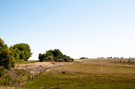 Scenic view looking down a long fence line in Colorado
