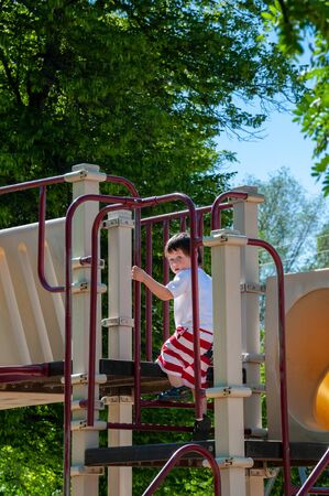 A Little boy enjoying his day at the city parkの写真素材