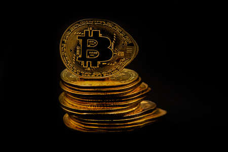 Representation of many colored and illuminated bitcoin coins. Feeling of power and wealth....