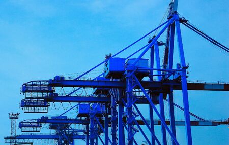 Cranes loading ship, container, Genoa port, Italy.の写真素材