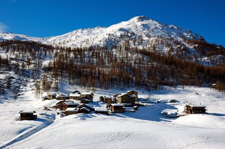 A little mountain village covered by snow, winter seasonの写真素材