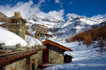A mountain lodge covered by snow, winter seasonの写真素材