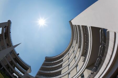 Looking up at a modern circular building; low angle view, fish-eye lens