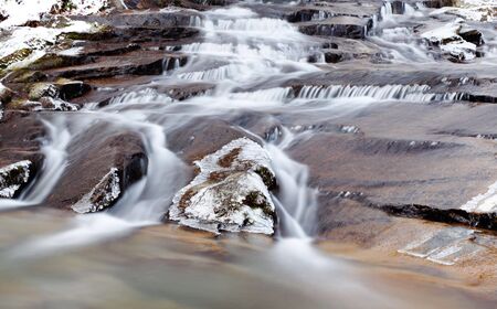 Mountain frozen waterfall, winter season, horizontal orientationの写真素材