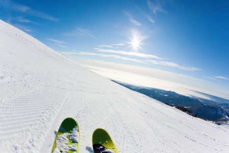 Skiing on a ski slope: closeup perspective, fish-eye lensの写真素材