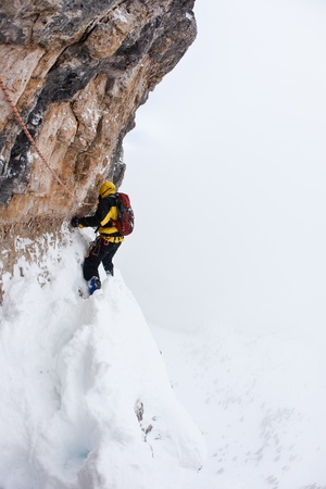 A dengerous pitch during an extreme winter climbing. Dolomiti (East Alps), Trentino, Italy, Europe.の写真素材