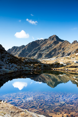 Mont Mars reflected in the Rosso lake in a sunny autumn day. Biella, Piemonte, West italian Alps, Europe.の写真素材