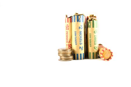 Nickel,dimes and pennies wrapped in coin-tainerの写真素材