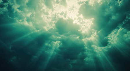 A vintage-style photograph of the sky, taken from an underwater perspective with sunlight filtering through clouds in shades of green and blue. The scene is set at dawn or dusk, creating a serene atmosphere with soft lighting and a focus on nature's beauty. Vintage style photography with a retro color palette, emphasizing the ethereal quality of light filtering through water and the tranquility of nature. --ar 47:26 --v 6.1 Job ID: bcb58534-b967-4002-8ccb-122d2881b67aの素材