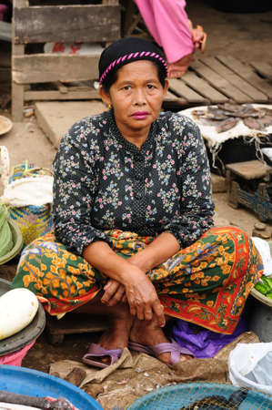 Photo from traditional exotic tribal market (pasar) in Indonesia on the Kalimantan island, Fish seller, Indonesia, Borneoのeditorial素材