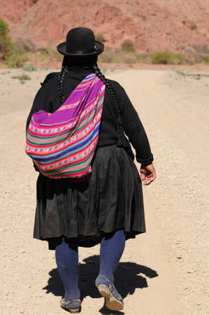 Bolivia - the most beautifull countryside near Tupiza. The landscape are full of colored rock, hills, mountains and fields on the rivers valleys. The native women going to home on the mountainのeditorial素材