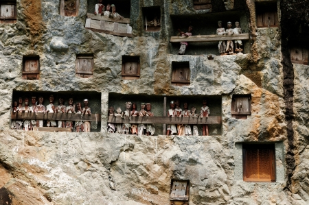 Indonesia, Tana Toraja - Londa, is a very extensive burial cave at the base of a massive cliff face The entrance to the cave is guarded by a balcony of tau tau  Inside the cave is a colection of coffins with the bones either scattered or heaped in piles  のeditorial素材