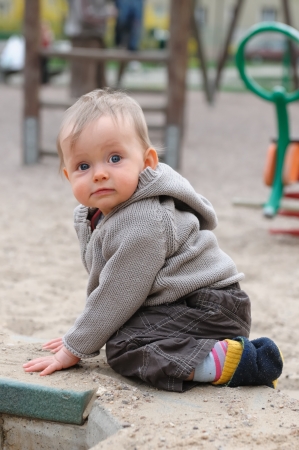 Baby girl plaing on the playgroundのeditorial素材