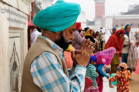 INDIA, AMRITSAR - NOVEMBER 29 Praying pilgrim in the Golden temple  Sri Harimandir Sahib , Amritsar...
