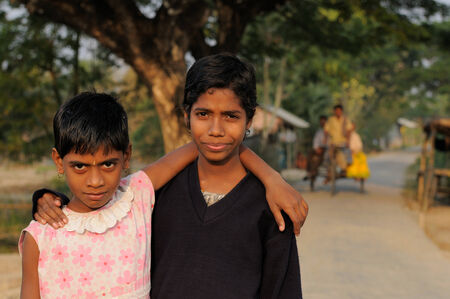 SUNDERBANS, INDIA - DECEMBER 11  Two young Indian girls coming back from the school,  Sunderbans in December 11, 2009のeditorial素材