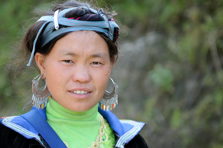 Sapa, Vietnam - October 22:  Woman in the traditional dress of Homong people settling on the  mountain regions of the Sapa town  on  October 22, 2010のeditorial素材