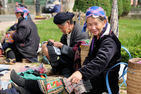 Sapa, Vietnam - October 24:  Woman in the traditional dress of Homong people on the market in the Sapa town  on  October 24, 2010のeditorial素材