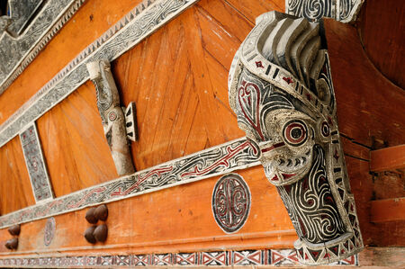 Batak carving totem standing in the middle of the village in the area of the Toba lake. Indonesiaのeditorial素材