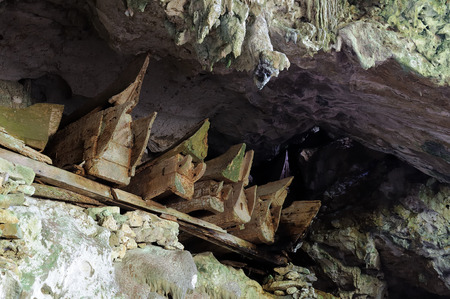 Wooden coffins with the body in sepulchral caves in the region Tana Toraja on an island Sulawesi in Indonesiaのeditorial素材