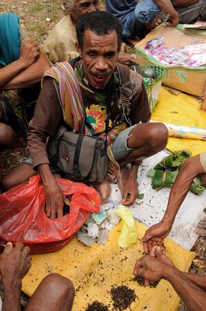 SOE TIMORINDONESIA APRIL 26: For seller of tobacco plant in the traditional exotic tribal market pasar in Indonesia on the island of Timor. Soe on April 26 2011.のeditorial素材