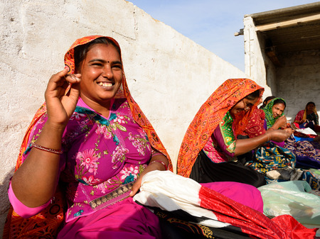 BHUJ INDIA JANUARY 13: Women sewing dresses ethnic living on the desert in the Gujarat state in India Bhuj in January 13 2015のeditorial素材