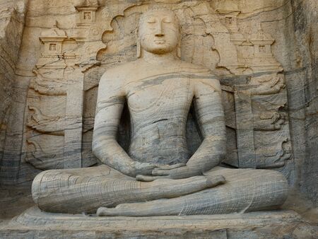 Polonnaruwa ruin was the second capital of Sri Lanka after the destruction of Polonnaruwa. The photograph is presenting  a seated Buddha sculpture at Gal Vihara. Sri Lankaのeditorial素材