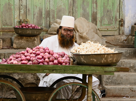 JUNAGADH, GUJARAT, INDIA - JANUARY 17: Muslim selling vegetables from carts in the street in the Junagadh city in the Gujarat state in India, Junagadh in January 17, 2015のeditorial素材